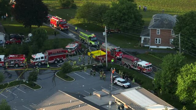 Aerial view of Fire trucks and firefighters at the propane gas leak explosion site in USA.