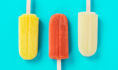 Close up of popsicles on the light blue background....