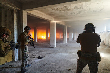  A group of professional soldiers bravely executes a dangerous rescue mission, surrounded by fire...