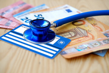 European health insurance card, euros money, medical stethoscope, concept international Travel...