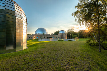 Sunset at the Silesian Planetarium. Reflecting the sky and sunbeams of the planetarium and...
