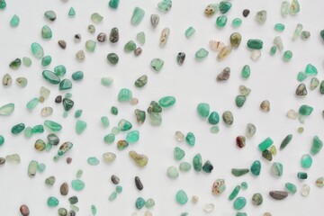 Close-up of green aventurine semi-precious natural polished gemstone mineral rock on white...
