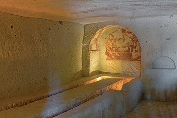 Refectory of Sandal church with scene of the Last Supper in wall niche. Goreme Open air museum. ...