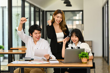 Teamwork, success and winning concept. Overjoyed businesspeople making yes gesture, celebrating corporate achievement