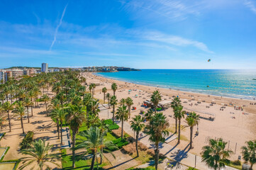 Beach in Catalan city Salou, Spain, Europe. Sea and palm in Catalonia