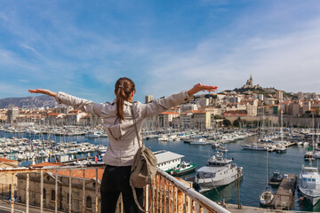 Tourist woman in french city Marseille. Marina and sea, France, Europe