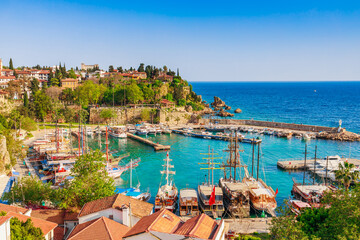 Fototapeta premium Old town Kaleici in Antalya, Turkey. Bay with ships and boats in summer