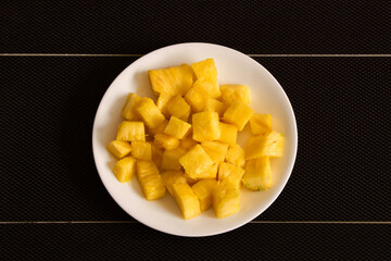 Tropical Flavors in Cerritos: small square snacks from the golden pineapple from Risaralda