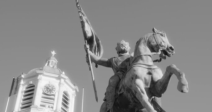 Black And White - Statue Of Godfrey Of Bouillon And Bell Tower Of Church Of St. James On Coudenberg In Brussels, Belgium. low angle