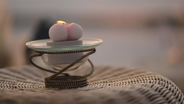 Decorative Candle Burning Outdoors, Romantic Atmosphere Of Date Or Wedding On Sandy Beach In Sunset