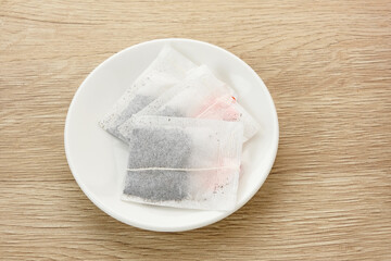 Tea Bag or tea sachet on white plate
