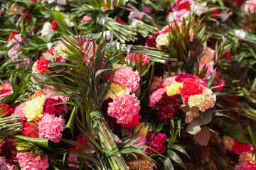 Obraz na płótnie Canvas Colorful carnation flowers for traditional religious celebration. Wedding floral decoration.