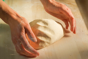 Hands making dough. Step by step making blueberry dumplings pierogi varenky at home. Process of...