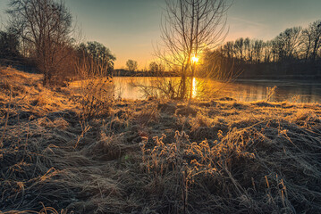 Snowy river shores and fields