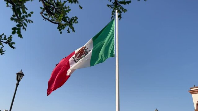 The National Mexican Flag waving in the wind in San Jose del Cabo, Mexico, slow motion
