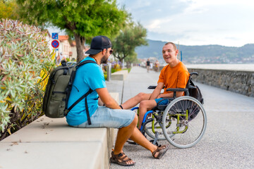 A disabled person in a wheelchair with a friends on summer vacation