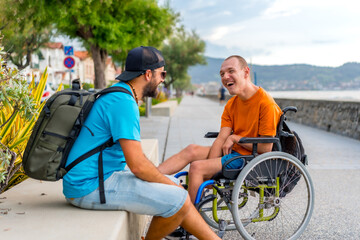 Disabled person in wheelchair with friends on summer vacation having fun