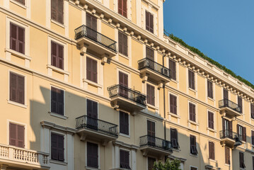 Renaissance balcony on a mediterranean building with shutters