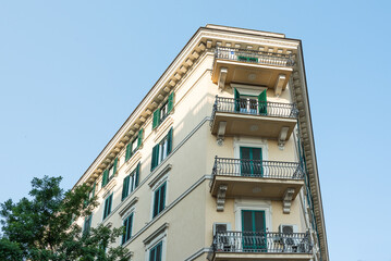 Renaissance balcony on a mediterranean building with shutters