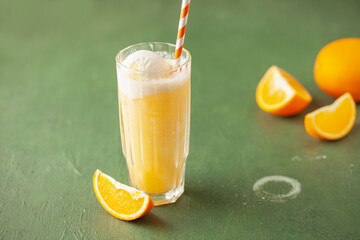 Homemade orange creamsicle in glass. Frozen orange juice with ice cream. Summer dessert.