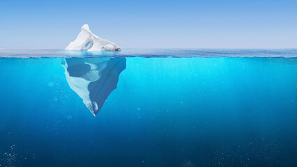Fototapeta na wymiar Amazing Iceberg in clear blue water sea and hidden danger under water. Iceberg - Hidden Danger And Global Warming Concept. Floating ice in ocean. Copy space for text and design. The tip of the iceberg