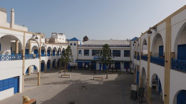 View of traditional blue and white architecture and place El Khaima, Essaouira