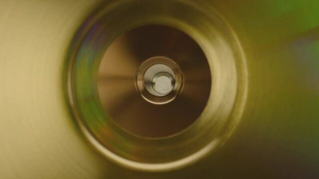 Camera moving inside golden metal tube . Stainless steel , copper clean pipe . Golden pipeline . Professional metal industrial production . Close up , slow motion . ARRI ALEXA Camera with Laowa lens