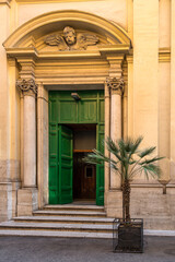 Church entrance door with a palm tree