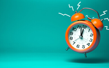 Orange classic alarm  clock on teal  background