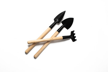 Wooden Gardening tools, shovel, rake on white background