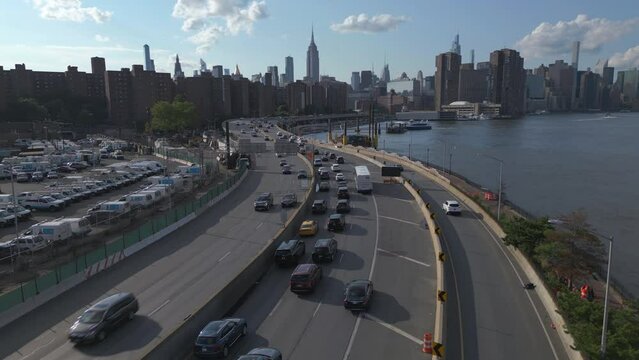 flying over FDR Drive traffic towards midtown NYC skyline