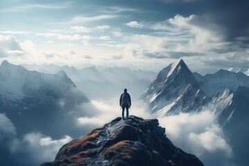 Man on top of mountain with beautiful sky landscape. 