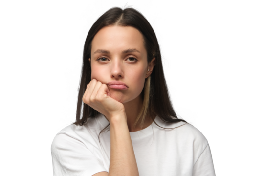 Portrait of bored young woman with head on chin
