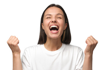 Close-up of emotional european woman showing white teeth while screaming with joy, holding hands in gesture of winner, isolated on gray background