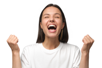 Close-up of emotional european woman showing white teeth while screaming with joy, holding hands in gesture of winner, isolated on gray background