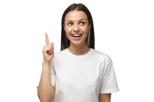 I have an idea! Young woman keeping finger pointed upwards, making gesture with index finger. Eureka, solution sign