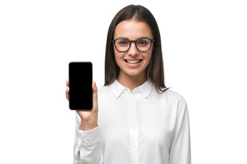 Young business woman wearing formal office shirt and big eyeglasses showing phone with blank screen...