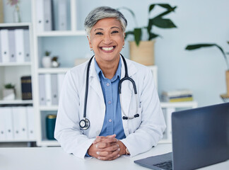 Doctor, portrait and woman in healthcare office for consultation, support and services, planning or advice. Happy face of medical worker or senior person for health insurance in clinic or hospital