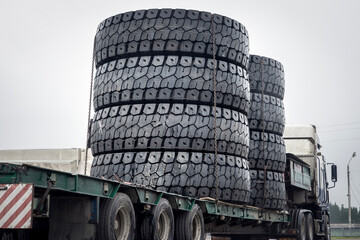 A set of huge haul truck tires on a trailer