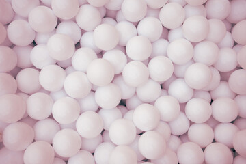 Many pink plastic balls for dry pool.