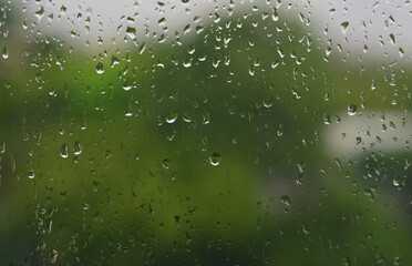 The water droplets on the glass are raindrops.