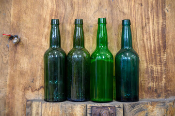 Bottles for traditional natural Asturian cider made from fermented apples in barrels for several months should be poured from great height, allowing lots of air bubbles into the drink.