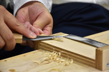 Japanese craftsman making a bamboo spatula, an important tool for working with Japanese lacquer urushi. Handmade arts and crafts.