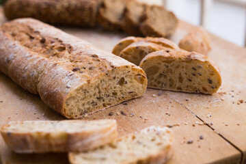 fresh loaf of bread on wooden board