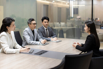 Confident Chinese businesswoman attending job interview