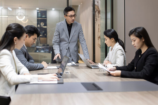 Chinese business people having a meeting in meeting room