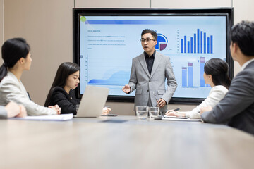 Confident Chinese business people having a meeting