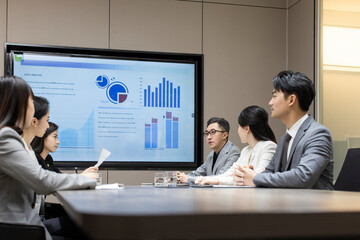 Confident Chinese business people having a meeting