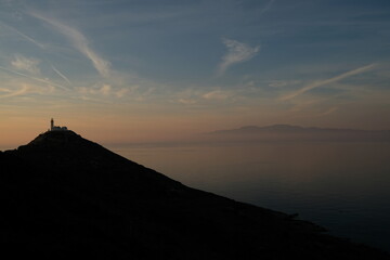 Lighthouseand clouds. Knidos lighthouse at sunset - Datca Turkey