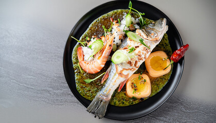 food fish elegant gourmet black plate top view lunch dinnerdish meal fine dining closeup green sea seafood shrimp beautiful modern